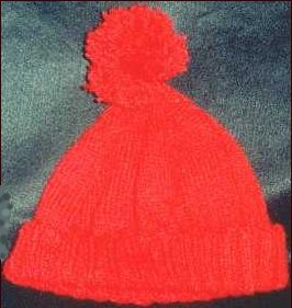 Knitted pom pom hat